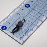 064-00003 Man walking with a gray backpack on his back : Tiny Tales - Colored 1:64