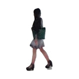 150-00008 Woman walking on the street with green tote bag under her arm : Tiny Tales - Colored N (1:150)
